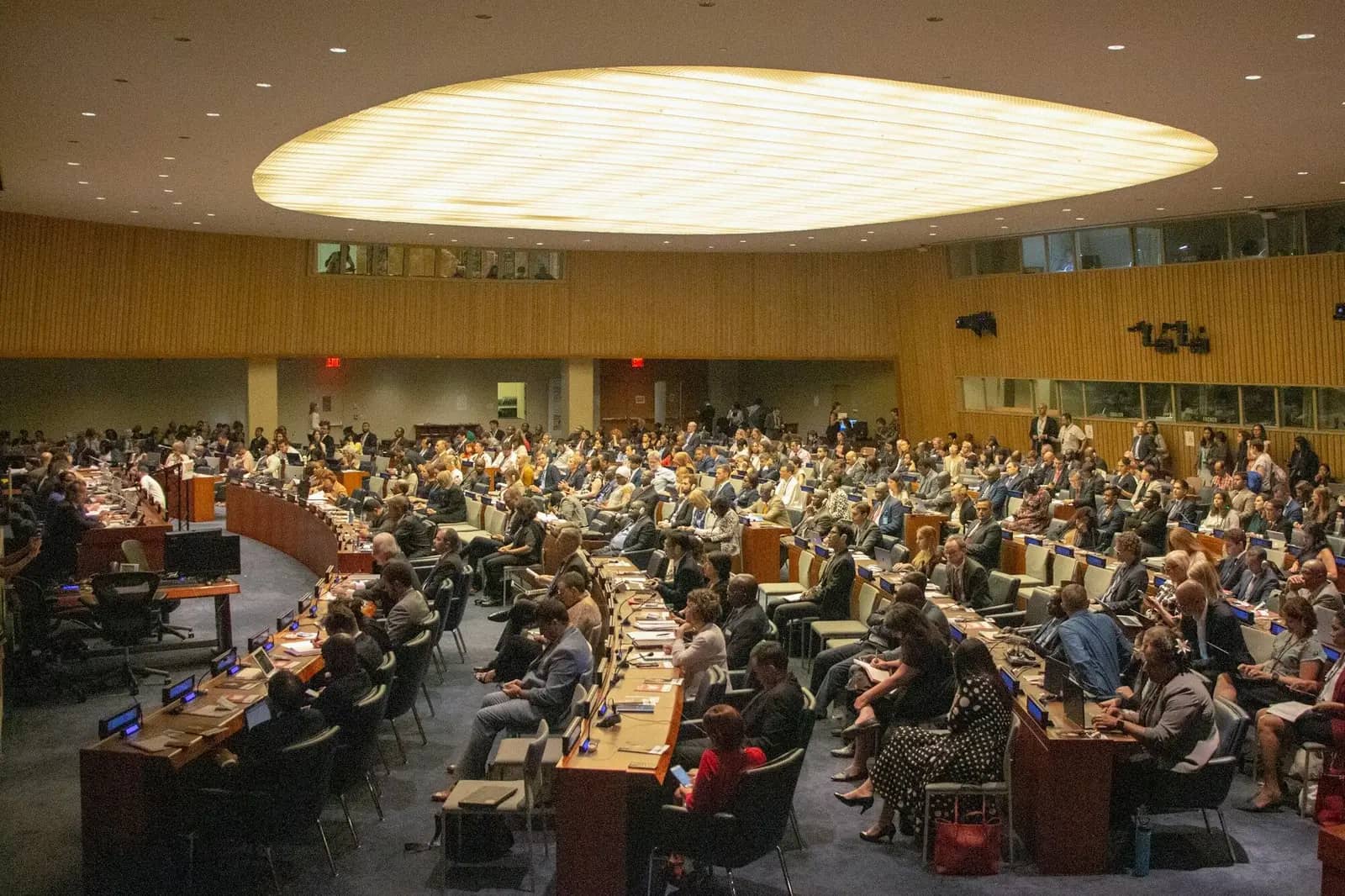 People seated inside a meeting room