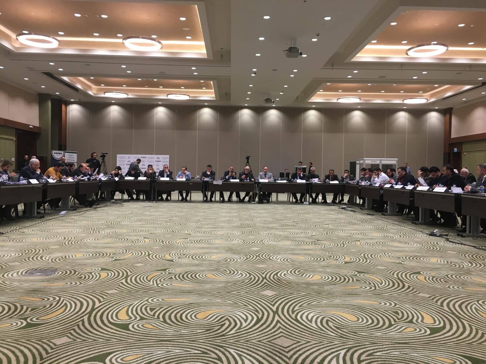 Conference participants in conversation
